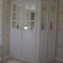 White painted corner wardrobes